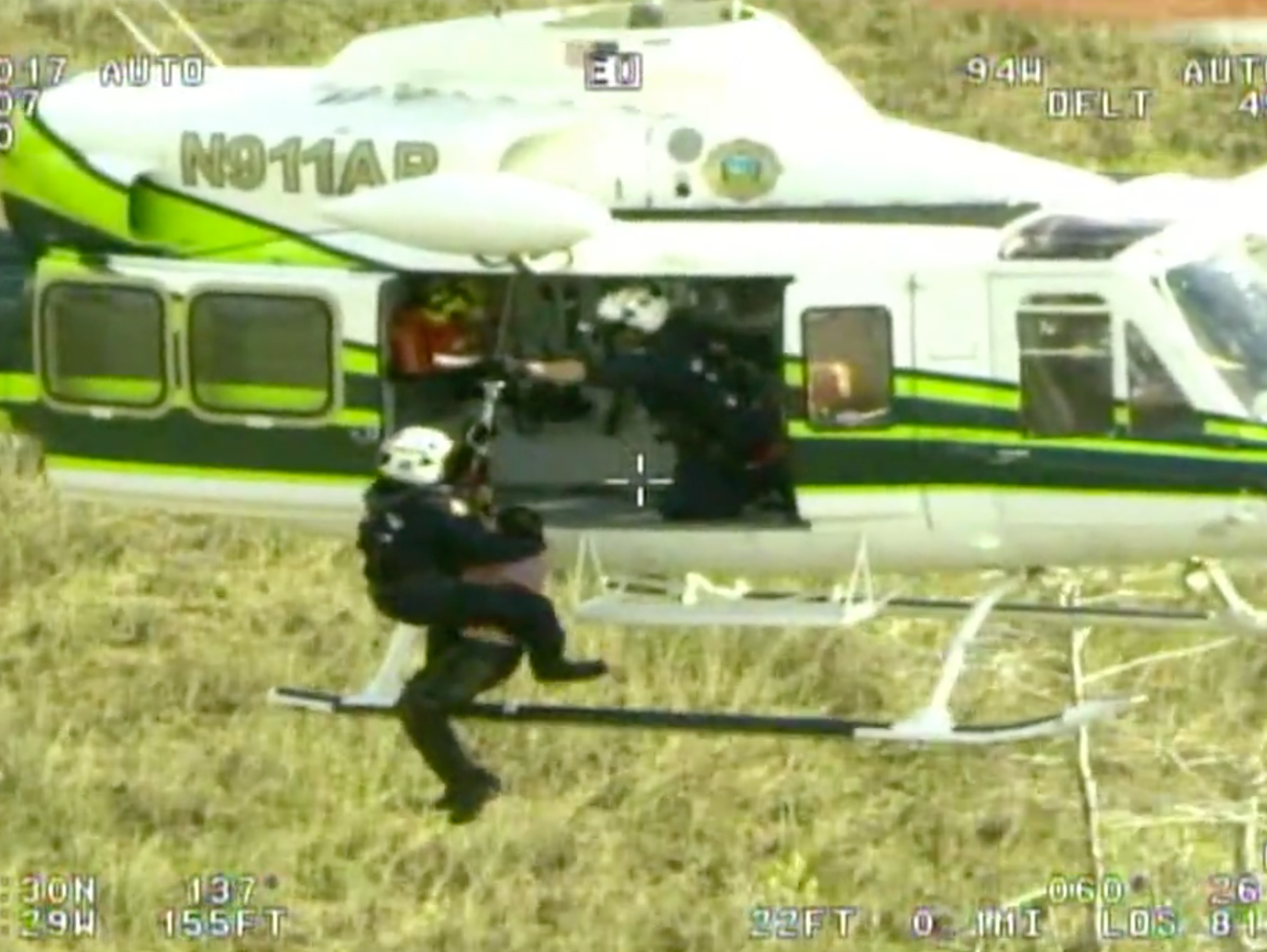 A Miami-Dade Fire Rescue helicopter rescues one of two hikers who were lost hiking the Florida Trail in the Everglades on Friday, Dec. 8, 2017.