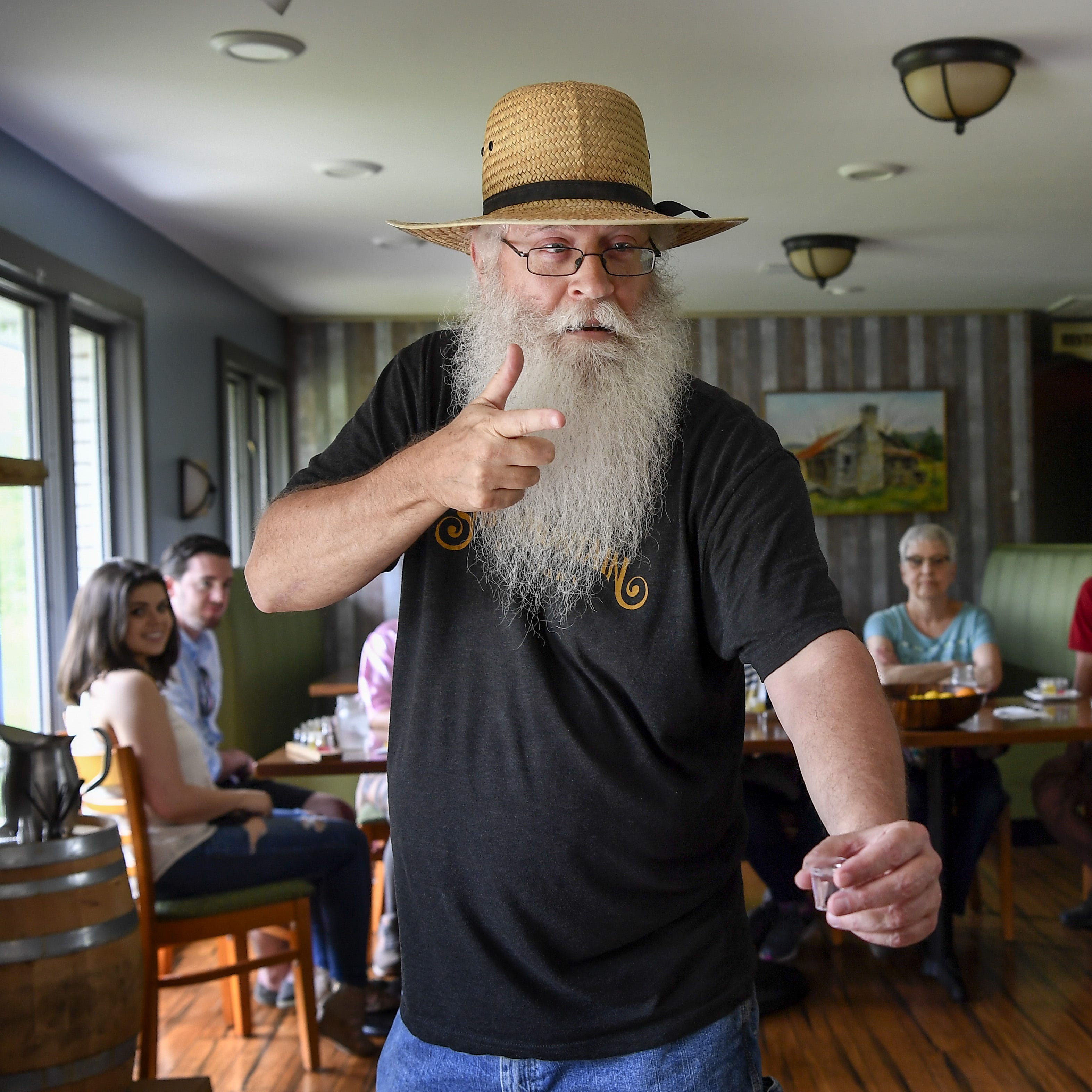 Tour guide Jeff Schuler tells stories about how bootleggers made people drink at gunpoint during the cocktail making class at the Short Mountain Distillery in Woodbury, Tenn.