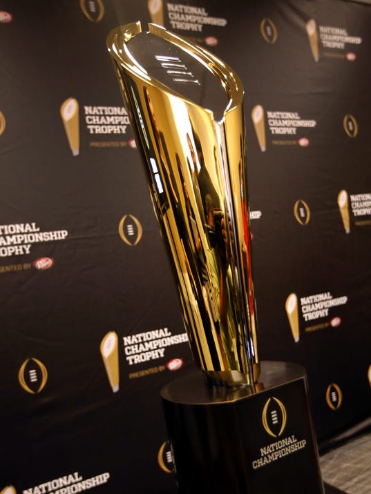 College football shows off new golden trophy for playoff champion