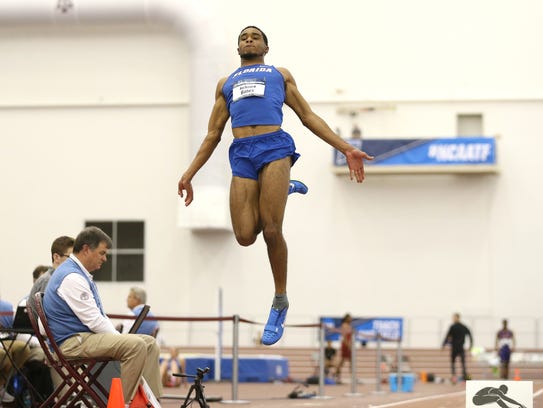 DeAndre Bates takes flight during the NCAA Indoor Track