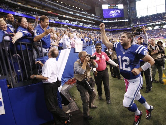 Colts quarterback Andrew Luck salutes fans after a