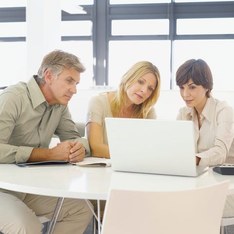 People looking at a computer