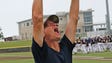 West Bend West coach Bill Albrecht yells to the crowd