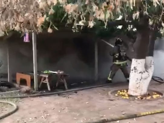 Mesa firefighters battle a basement fire at a home