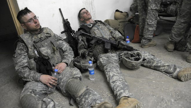 U S Soldiers From 1st Infantry Division Lie Exhausted On The Floor At