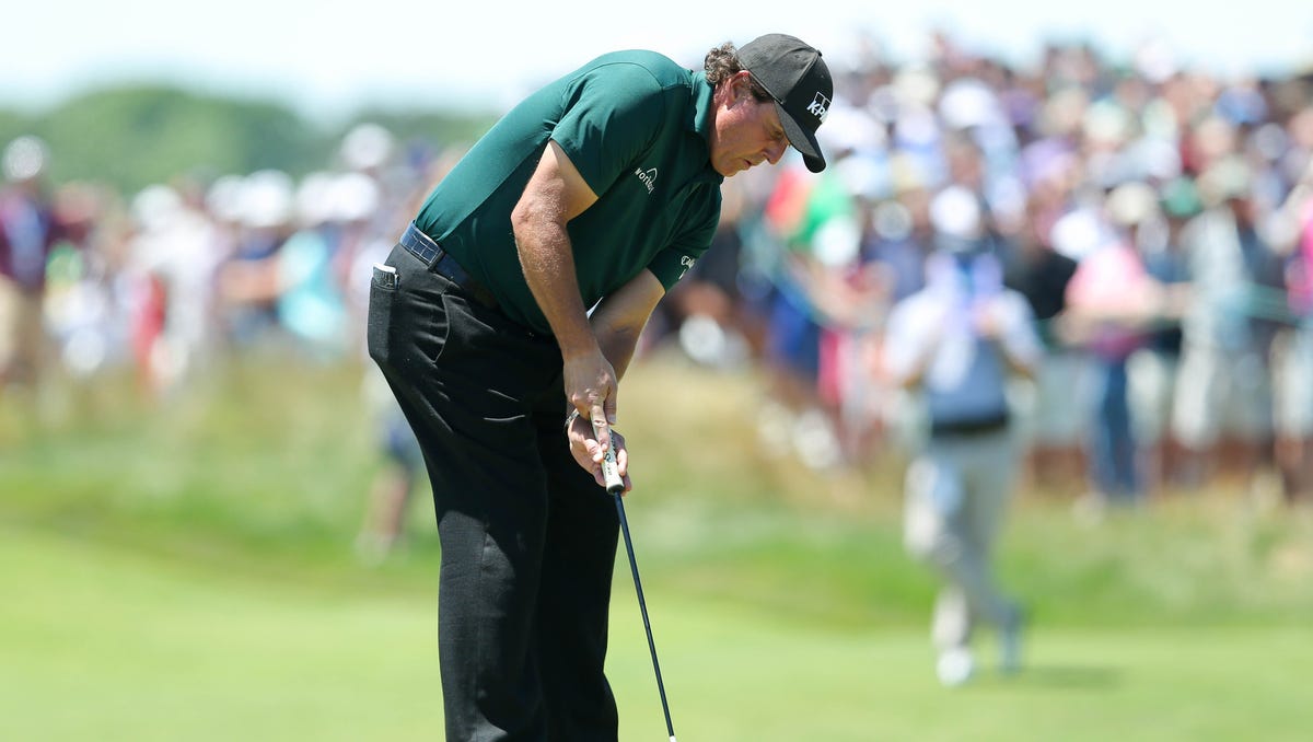 Phil Mickelson putts the fifth green during the third round of the U.S. Open golf tournament at Shinnecock Hills GC - Shinnecock Hills.