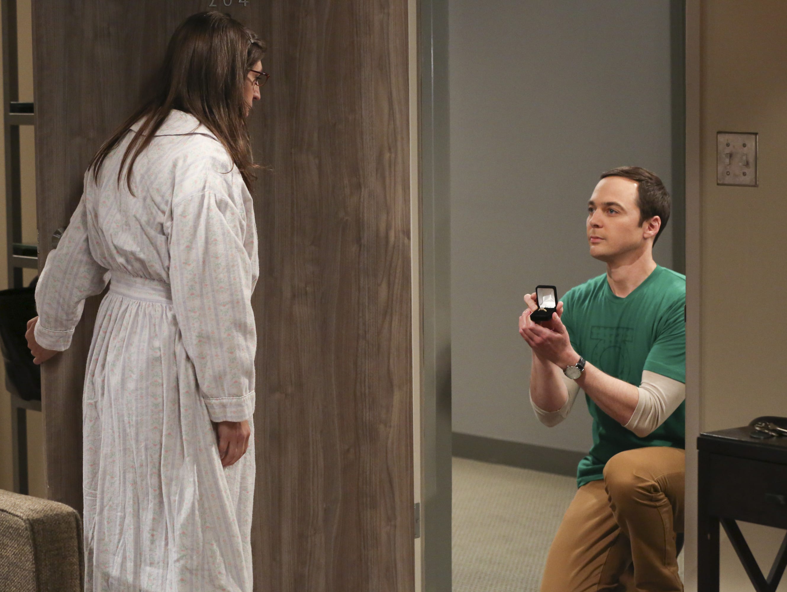 Sheldon (Jim Parsons), right, pops the question to Amy (Mayim Bialik) at the end of the Season 10 finale of CBS's 'The Big Bang Theory.'