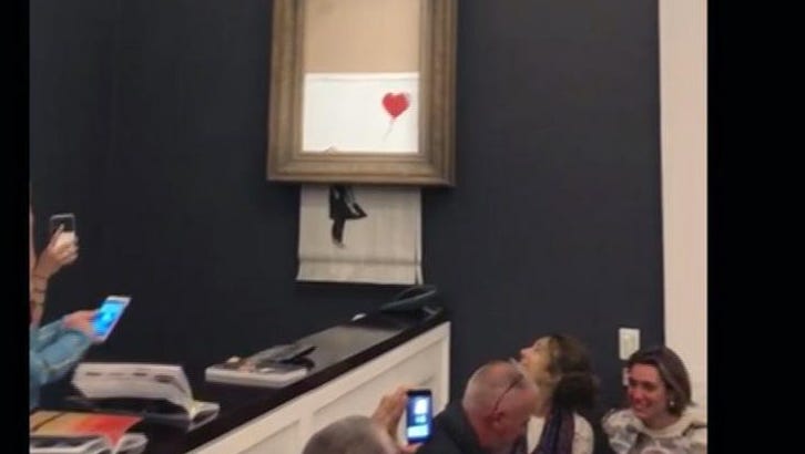 Banksy Artwork Self-destructs Moment After $1.4M Sale