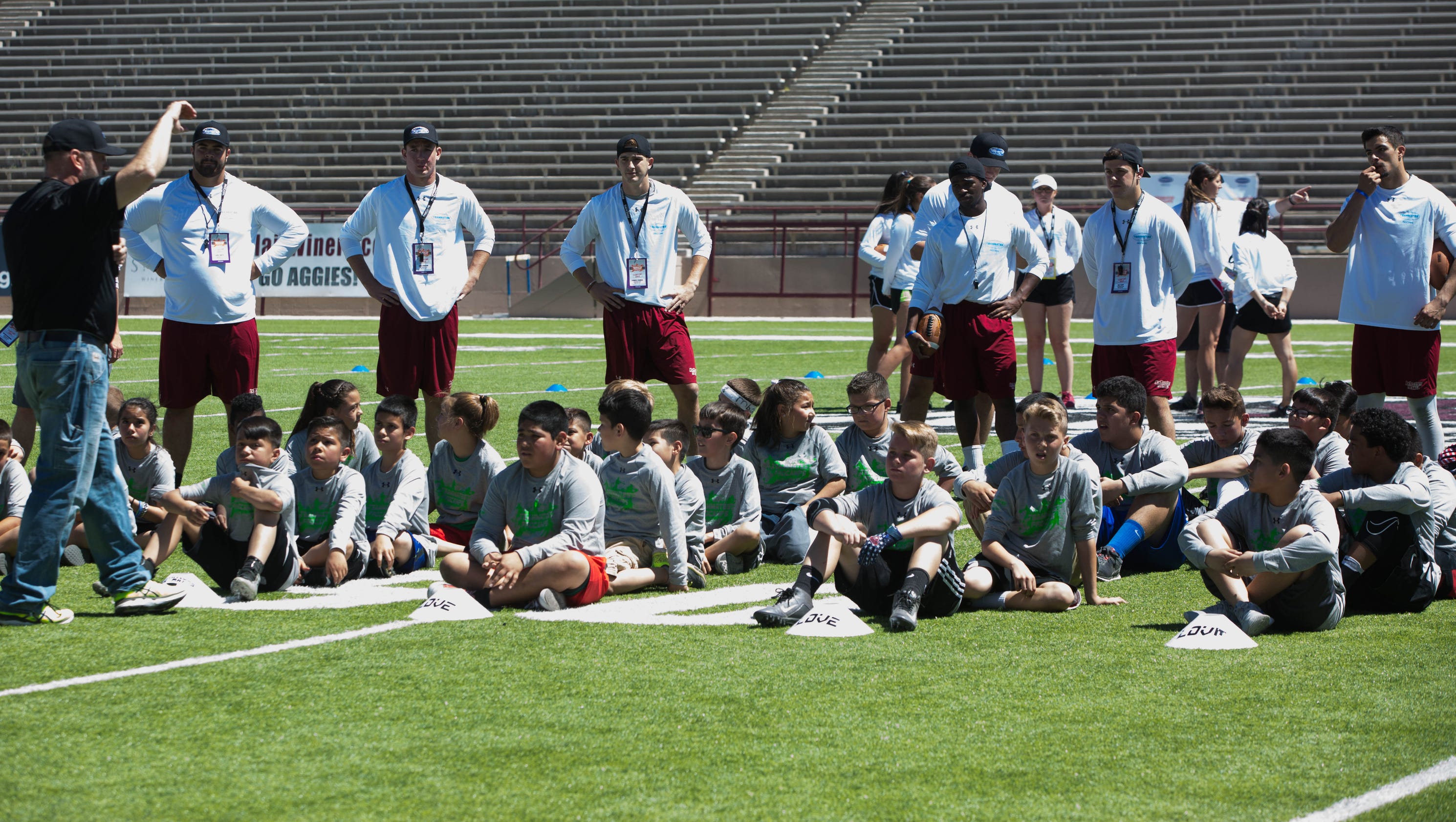 Brooks, Teammates for Kids conduct youth football camp