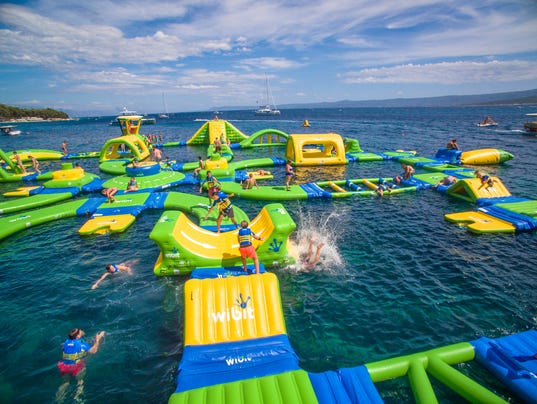 Jump on these floating water parks across Michigan