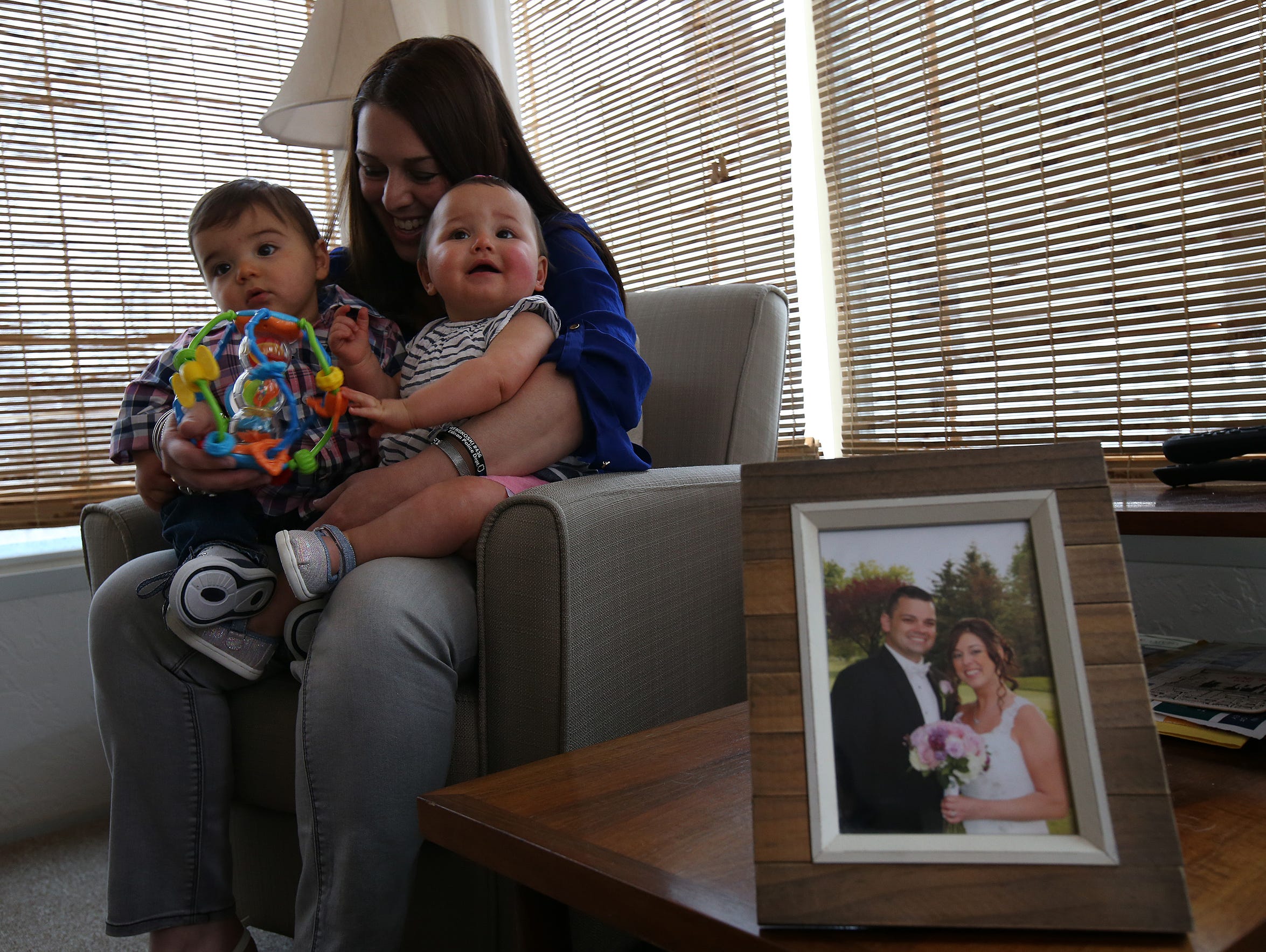 Tracy Wenskoski holds her 10-month-old twins, Joseph and Isabella, at their home in North Plainfield.