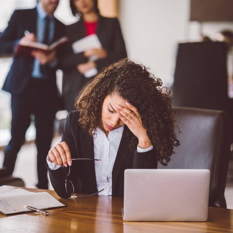 Stressed person sitting in front of office compute