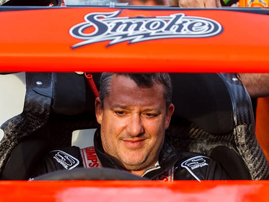 Former NASCAR driver Tony Stewart readies his sprint