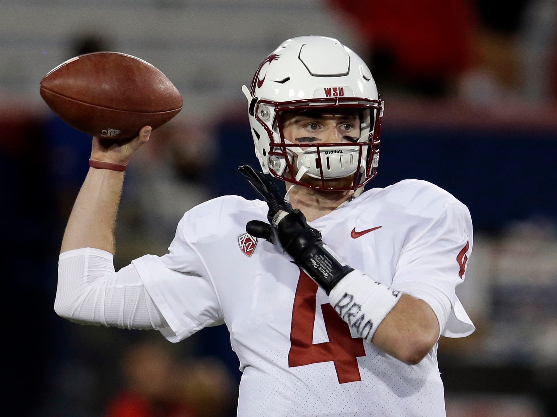 Washington State quarterback Luke Falk warms up before an NCAA college football game against Arizona, Saturday, Oct. 28, 2017, in Tucson, Ariz. (AP Photo/Rick Scuteri)