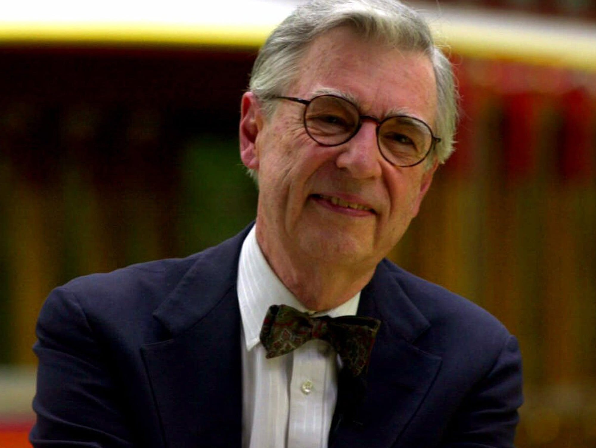 FILE--Fred Rogers tapes a public service announcement in front of the neighborhood trolley at Idlewild Park in Ligonier Pa. in this Aug. 8 2000 file photo. Rogers who has helped generations of children flourish encouraged Middlebury College graduates