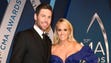 Carrie Underwood and husband Mike Fisher on the red