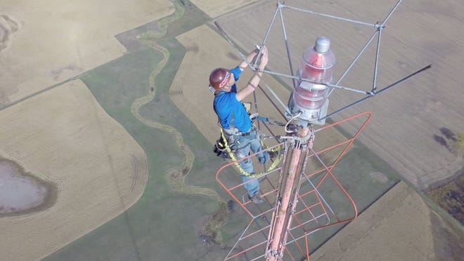 Kevin Schmidt Is Seen Climbing An Antenna And Taking A Selfie In