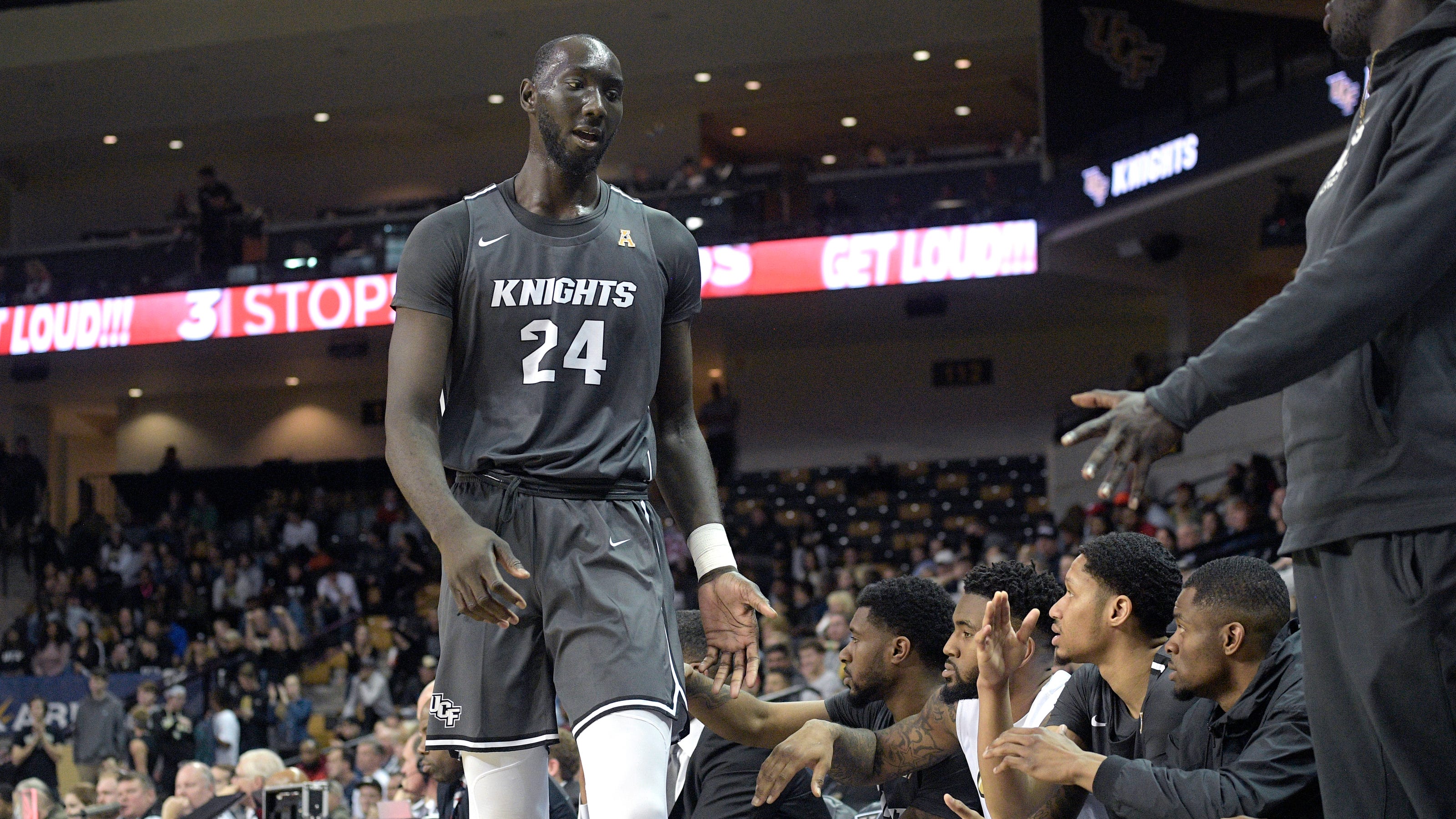 March Madness UCF's Tacko Fall poses next to CBS reporter