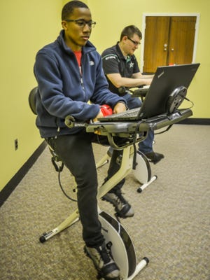Students Sweat It Out And Study On Library Exercise Bikes