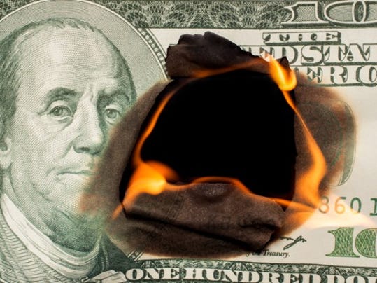 hundred-dollar-bill-on-fire-losing-money-investment-debt-credit-getty_large.jpg