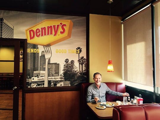 A photo uploaded to Facebook by the CEO of Netflix, enjoying a steak dinner at Denny's.