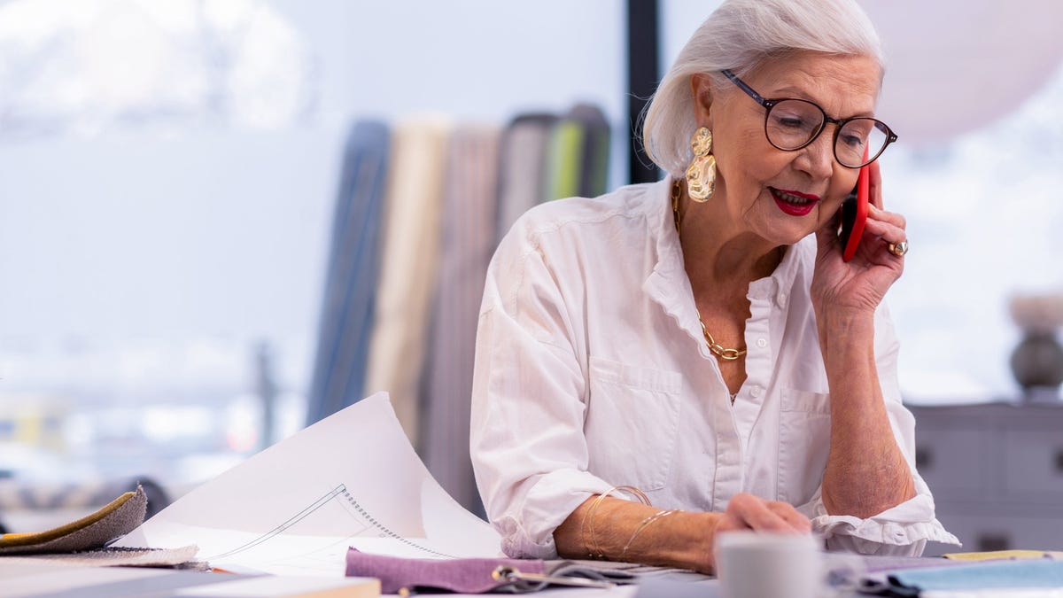 Senior woman working at a desk.