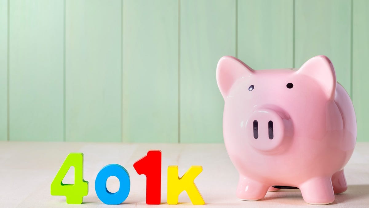 Colorful letters spelling out 401(k) sitting next to piggy bank.