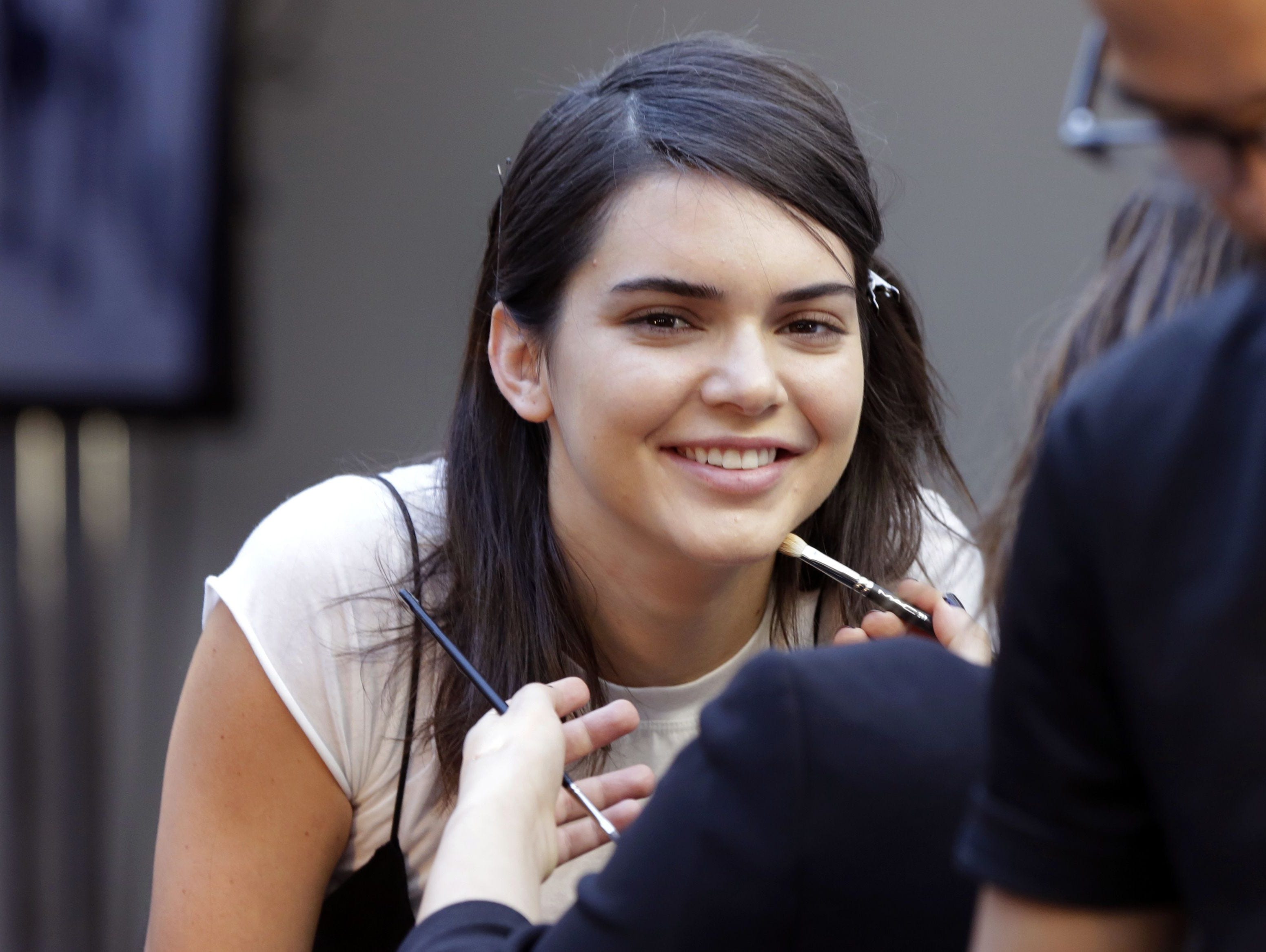 Model Kendall Jenner's Pepsi ad is being taken off the air. Here she is getting makeup for a modeling session.