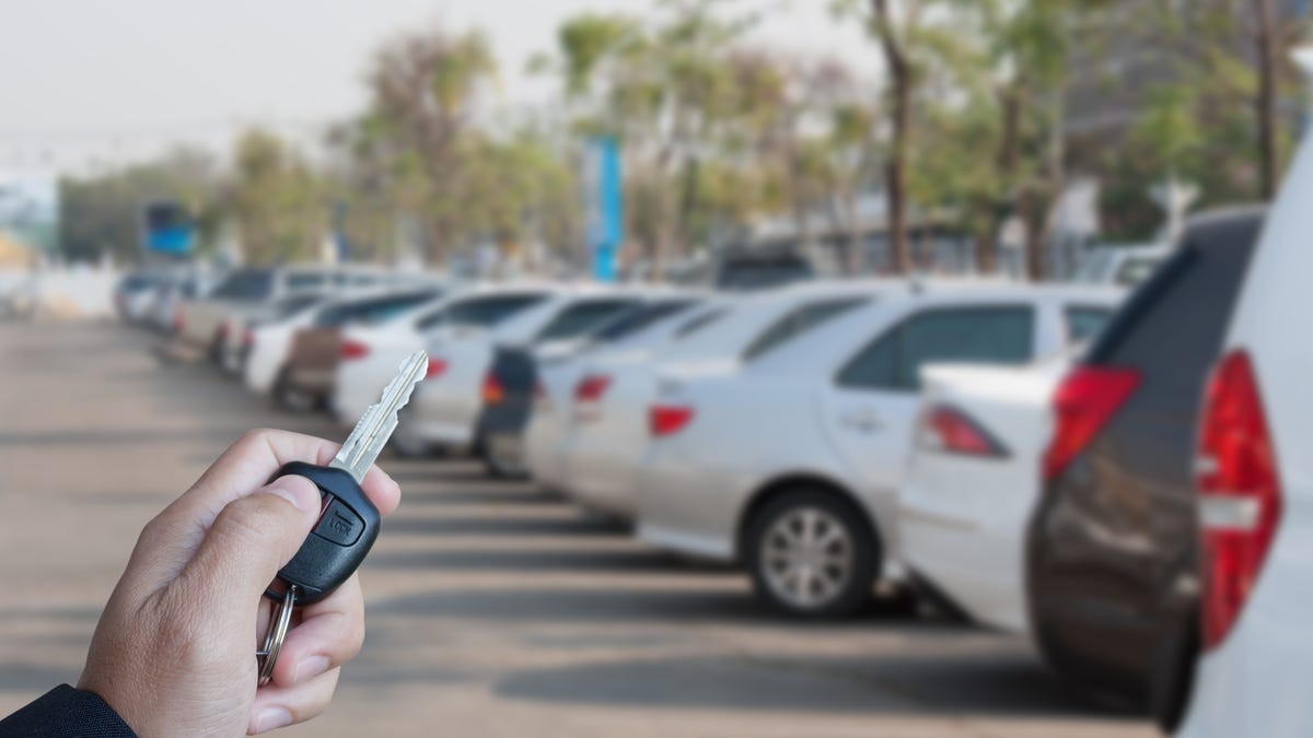 A row of vehicles at a car dealership.