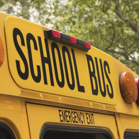 Back of school bus with a sign. Generic image fem 