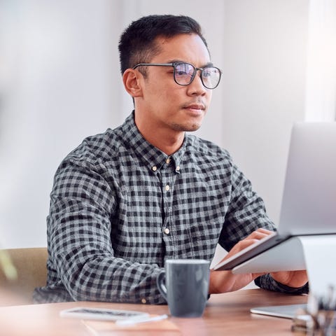 A person at a laptop.