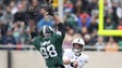 Michigan State's Demetrius Cooper tips a pass by Penn