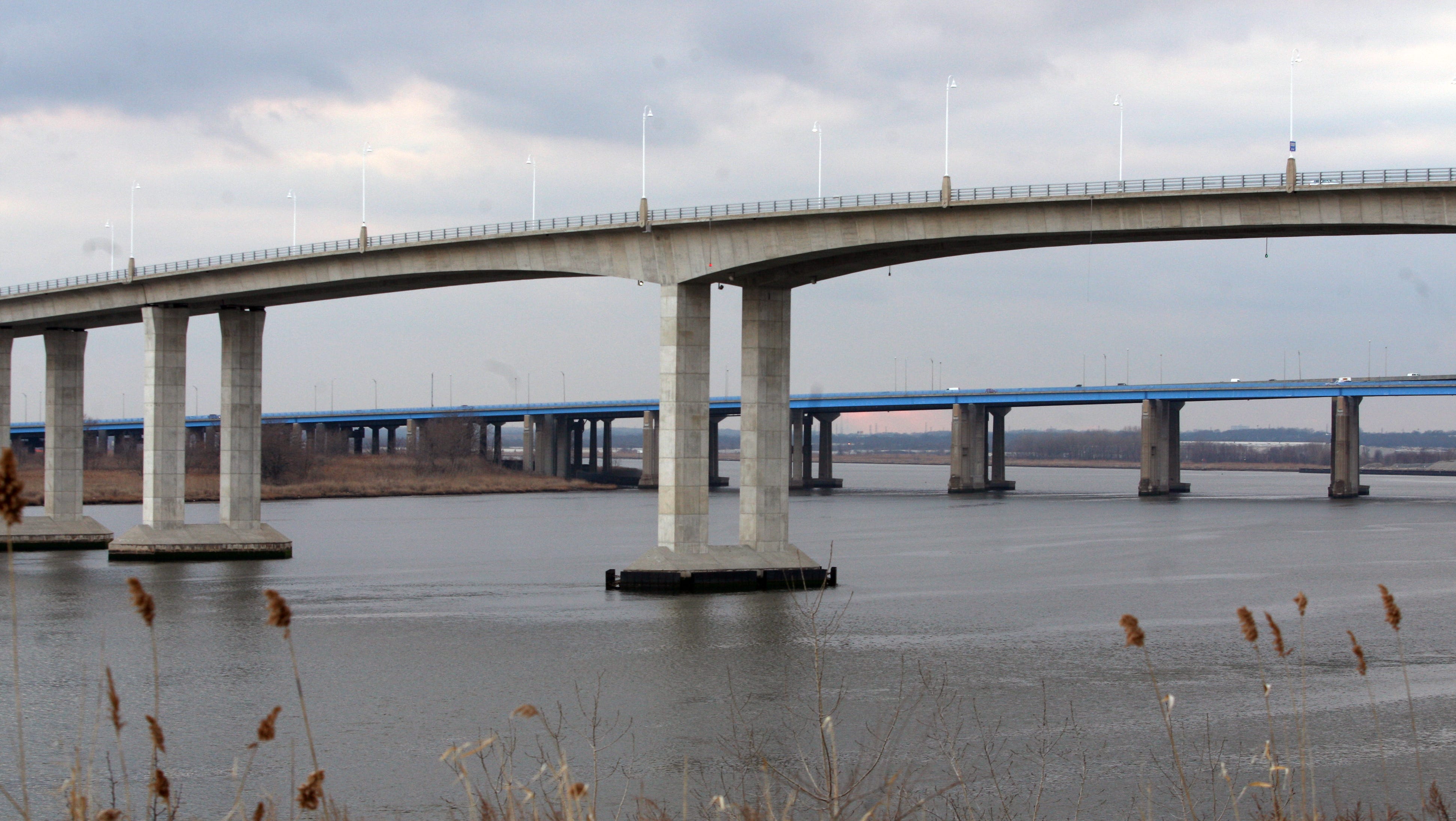 m.t.a. plunges feet dangles from overpass