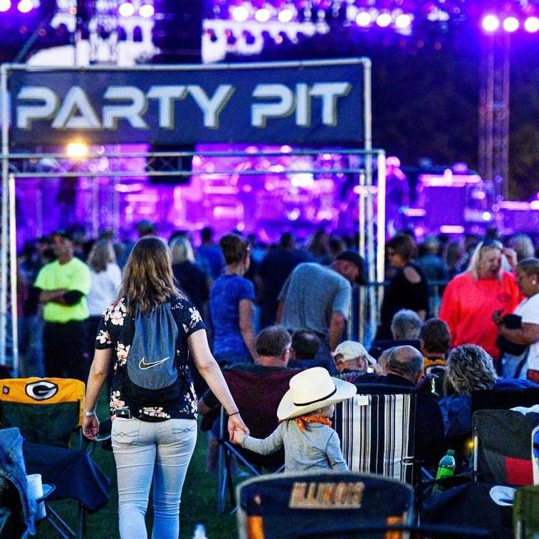 Fans gather in front of the main stage of the Tailgate N' Tallboys music festival in 2018 at Riverfront Park in Peoria. Following a venue change and a cancellation this year, Tailgate N' Tallboys is to return in 2021 to Peoria, at least in part.