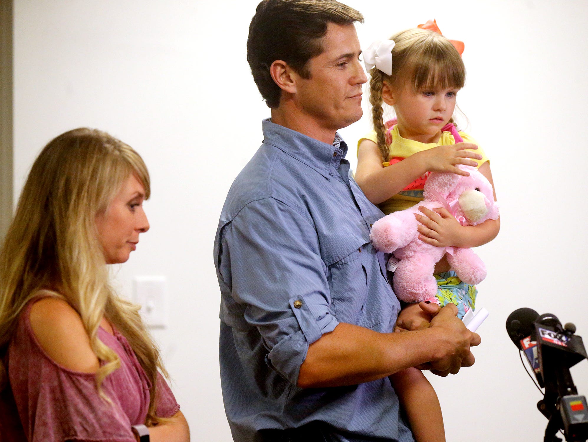 Patrick Hale, center, spoke during a press conference at the Rutherford County Sheriff's Office with his wife Danielle and 3-year-old daughter (refused to release name) on Friday June 16, 2017, about how the Georgia fugitives surrendered on the Hale'