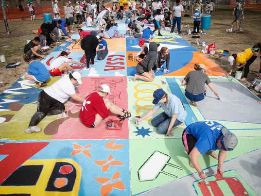 Watch the paint fly as students get colorful at Drake's street painting