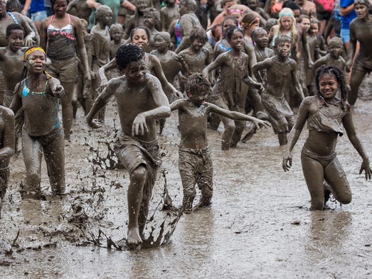 Thousands get down and dirty at annual Mud Day in Nankin Mills Park