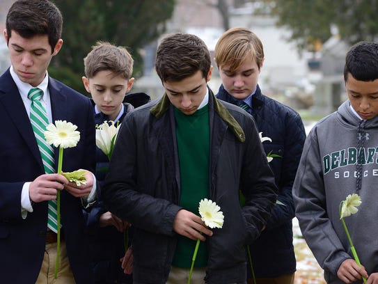 Students from Delbarton School in Morristown hold a