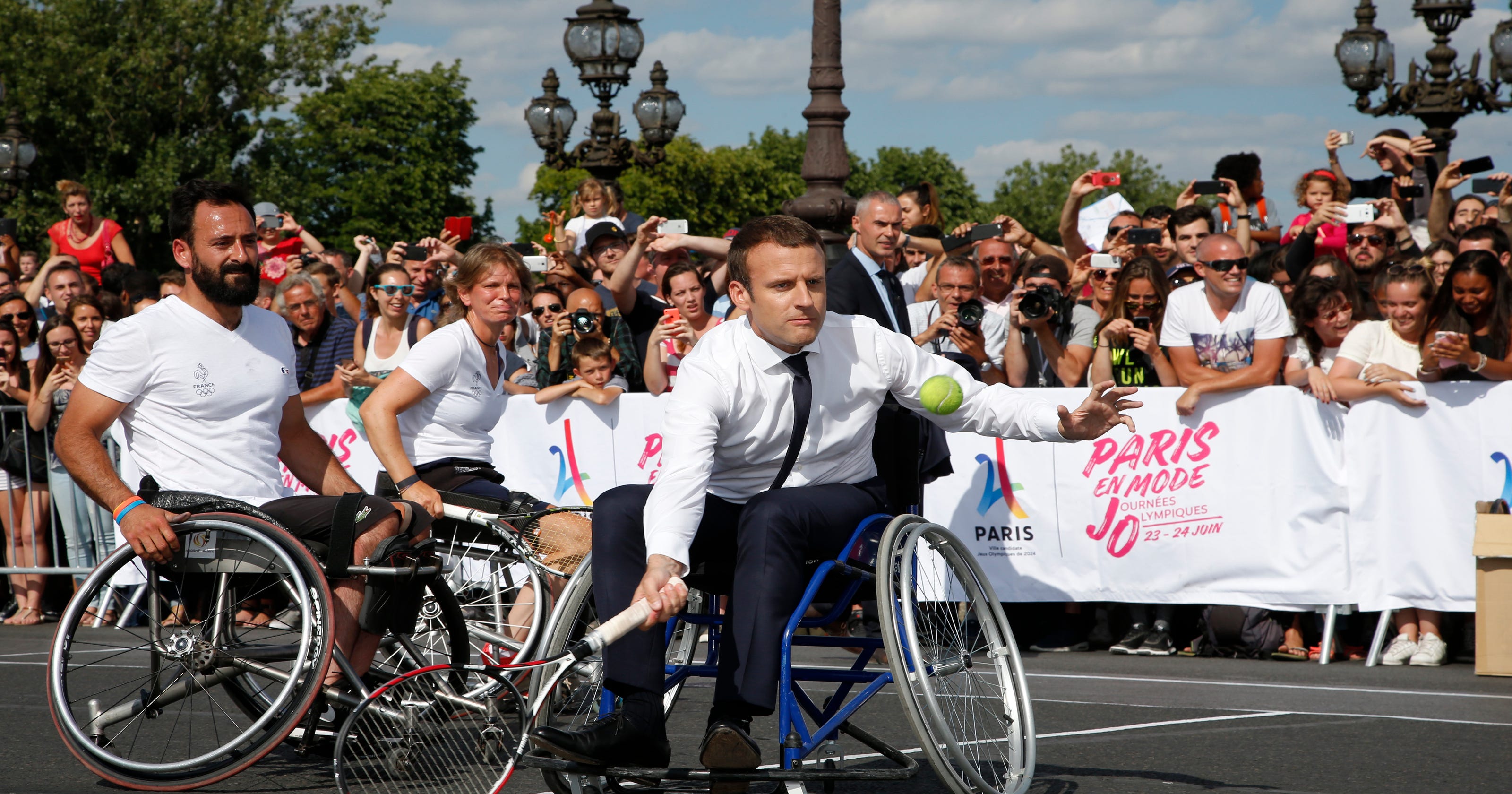 Macron promotes Paris 2024 Olympic bid playing tennis