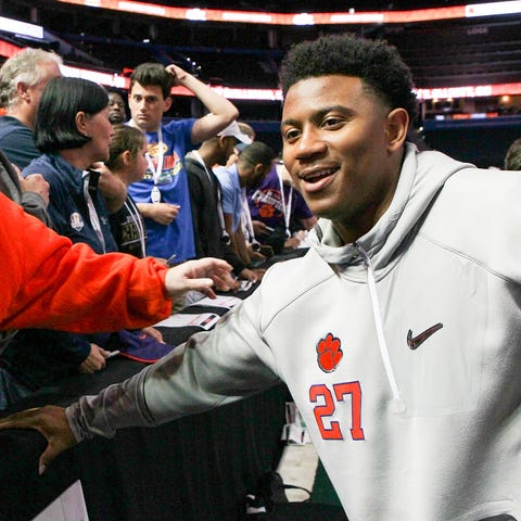 Clemson running back C.J. Fuller, right, of...