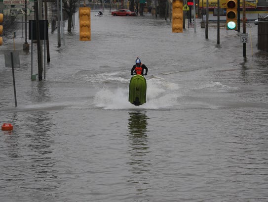 Some water enthusiasts used their Jet Skis and kayaks Saturday to take advantage of the flooding that occurred in Kalamazoo.