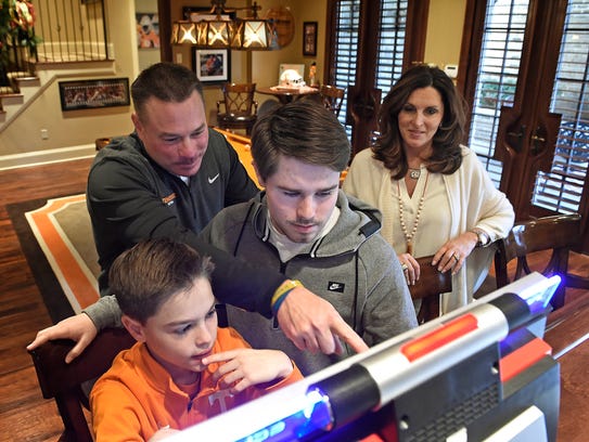 Butch Jones watches over his sons Andrew, left, and