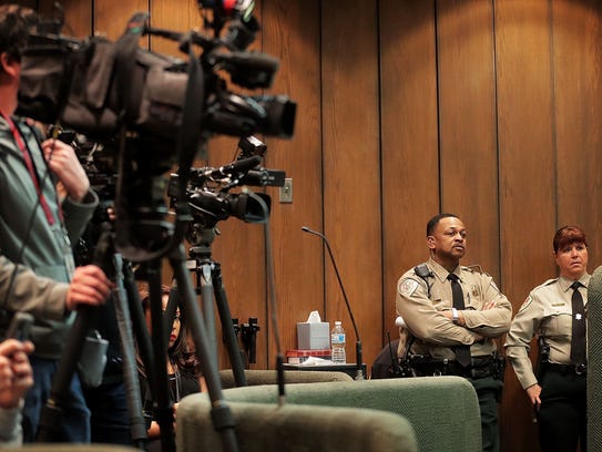 Cameras crowd the jury box before the start of a hearing