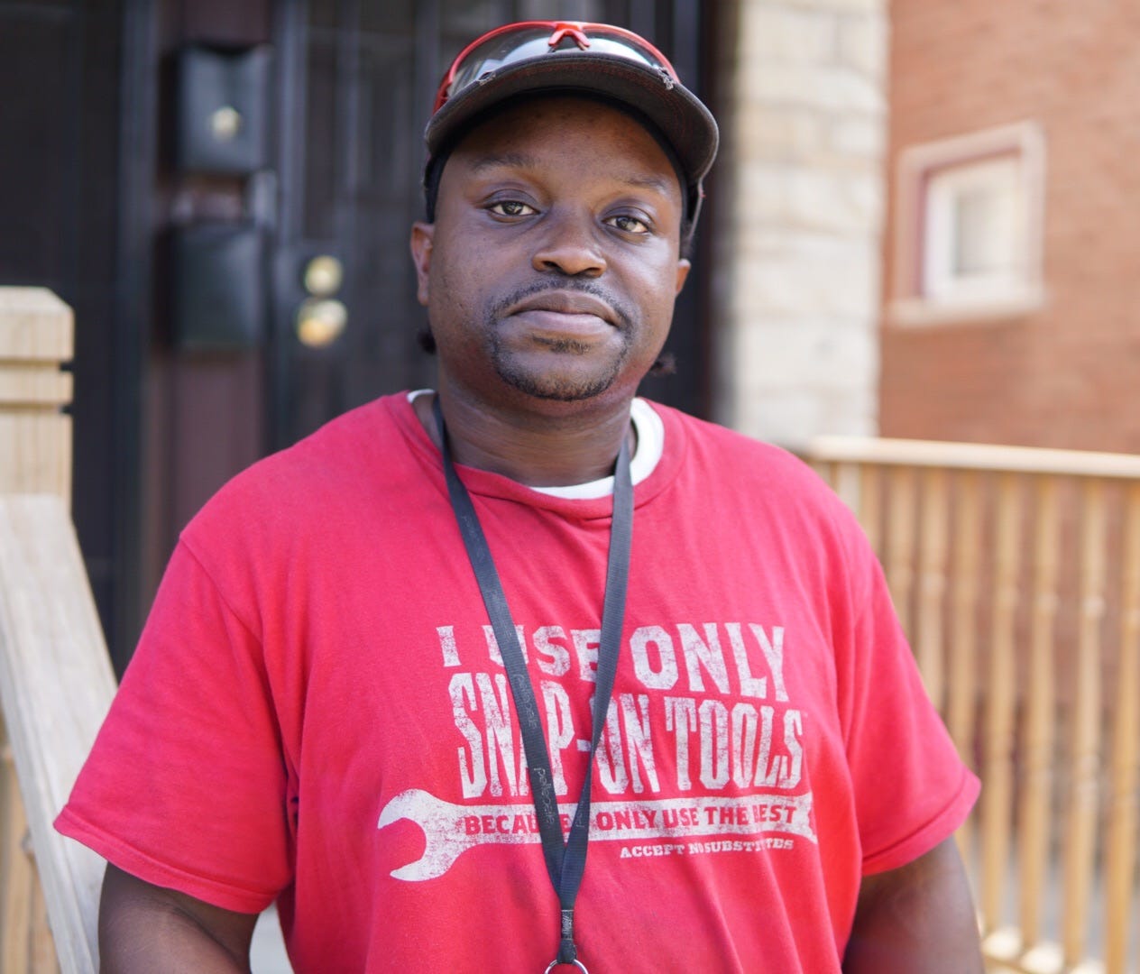 Michael Williams landed a job at Snap-on Inc. after his release from prison. He trained on CNC machines while still incarcerated. He's pictured in front of a duplex that he owns on the near west side of Milwaukee.