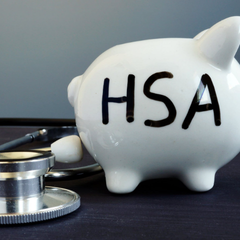 A piggy bank with the letters HSA for health savin