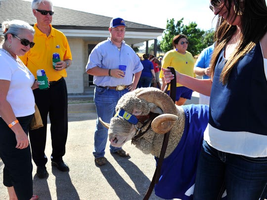 Ram Jam fans gather around Dominick and his handler, Brittany Workman, during a Ram Jam at the LeGrand Alumni Center in September 2015.