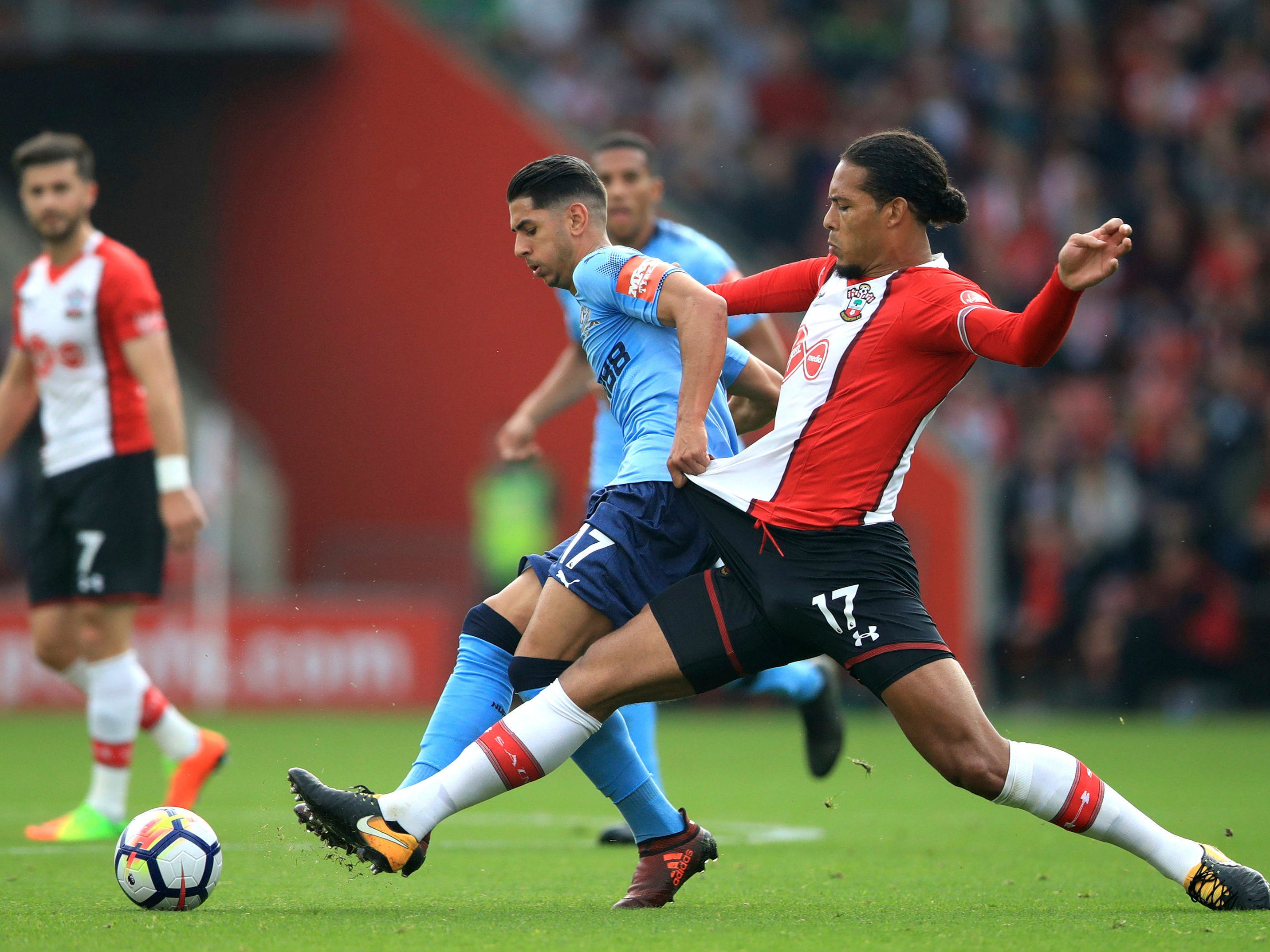 Newcastle United's Ayoze Perez, left, and Southampton's Virgil van Dijk battle for the ball during their English Premier League soccer match at St Mary's, Southampton, England, Sunday, Oct. 15, 2017. (John Walton/PA via AP)