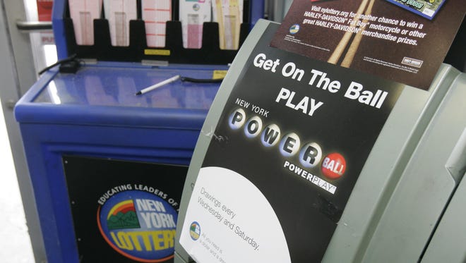 A promotional poster for Powerball sits next to the other lottery forms.
