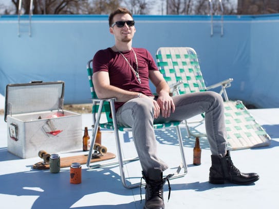Morgan Wallen sits in a shot from his "The Way I Talk"
