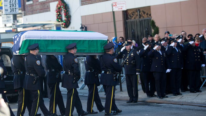 The Casket Of New York City Police Officer Rafael Ramos Is Carried Into